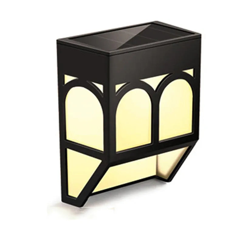 Square white solar-powered outdoor wall lamp with LED light, mounted on a fence post.