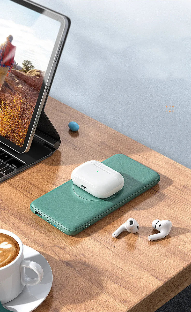 Mint green magnetic wireless power bank with back clip showing MagSafe charging surface