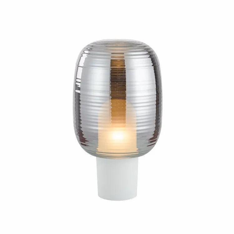 A simple modern glass table lamp with a Nordic design, shown in a cognac colour finish.