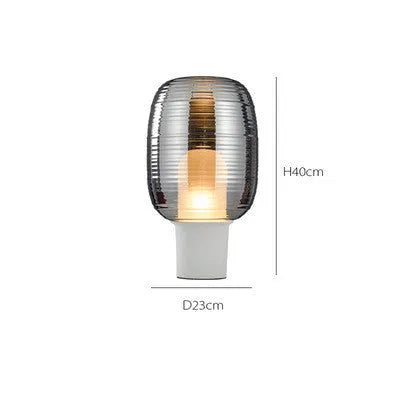 A simple modern glass table lamp with a Nordic design, shown in a cognac colour finish.