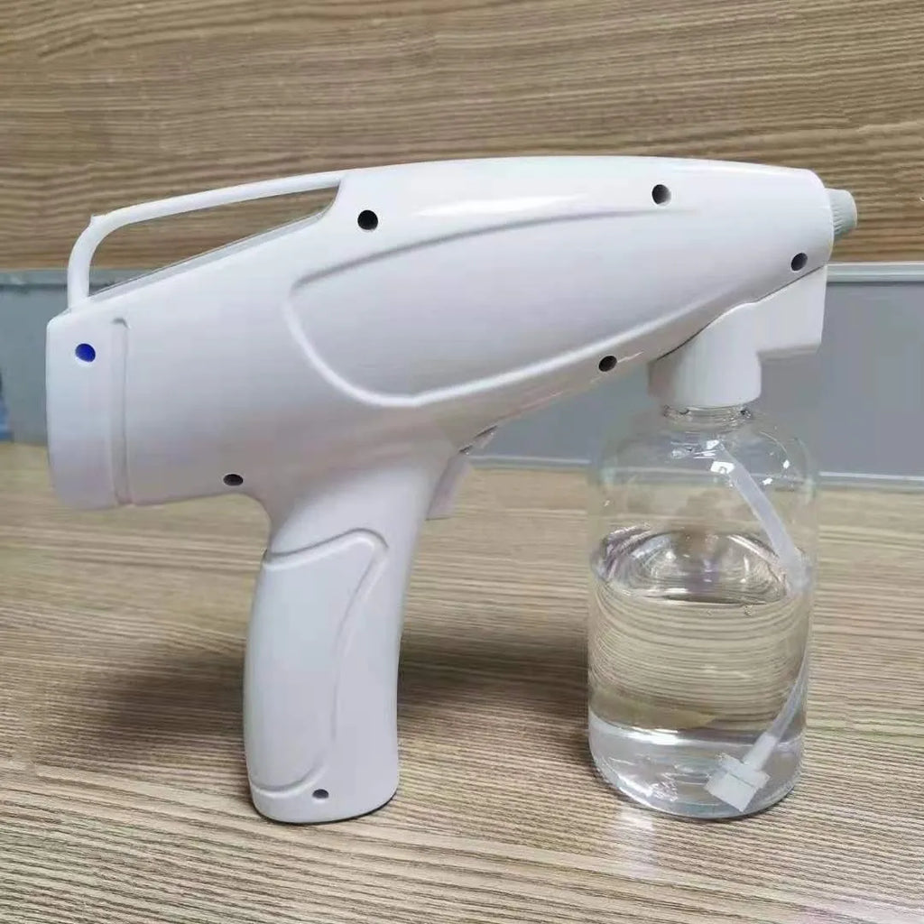 White handheld wireless electric disinfection spray gun with USB charging cable