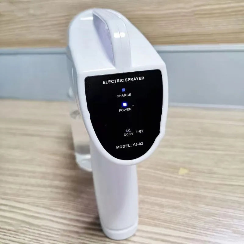 White handheld wireless electric disinfection spray gun with USB charging cable