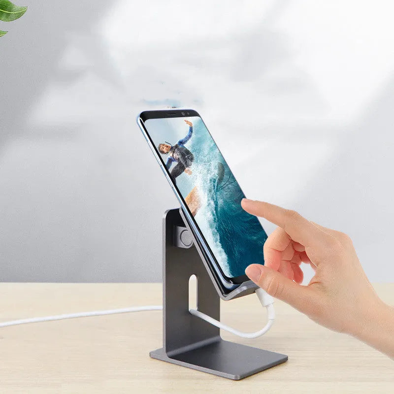 Alloy metal desktop stand holding a mobile phone, shown in dark space grey and streaming silver colours.