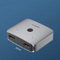 Grey Haibeisi HDMI splitter switcher with 1 input and 2 output ports for computer TV monitor video sharing