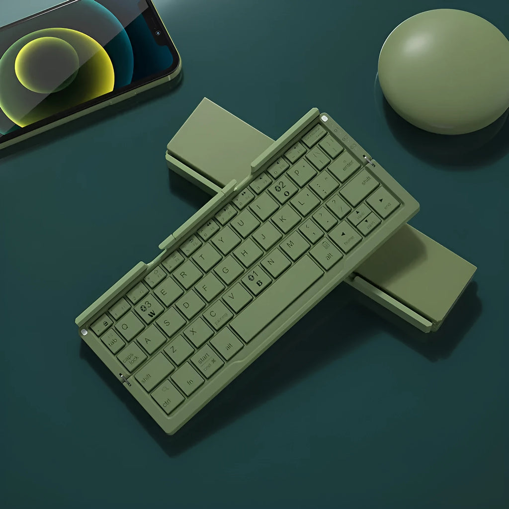 Silver aluminium folding Bluetooth keyboard open with smartphone propped on integrated stand