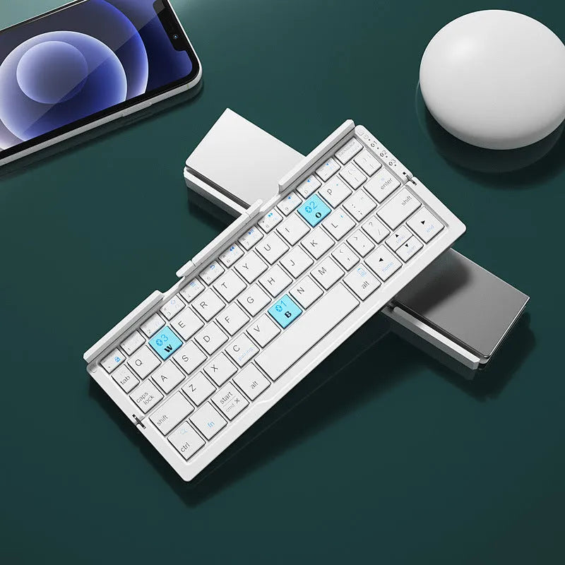 Silver aluminium folding Bluetooth keyboard open with smartphone propped on integrated stand