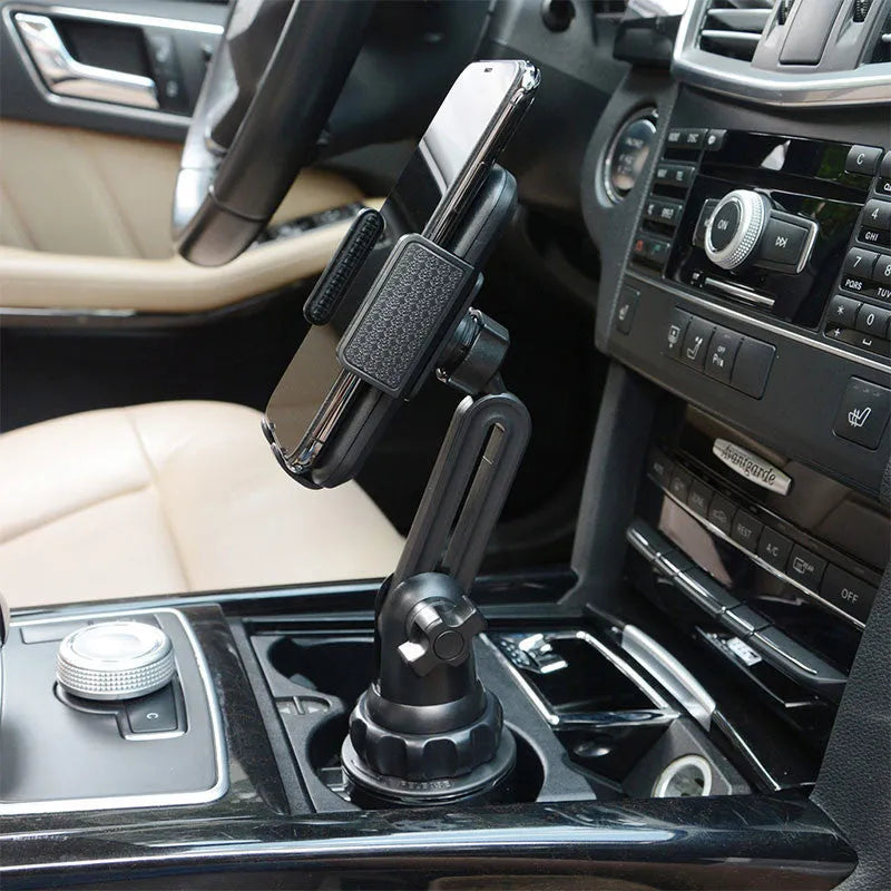 Black car phone holder with 360-degree rotating head and adjustable height arm on a dashboard.