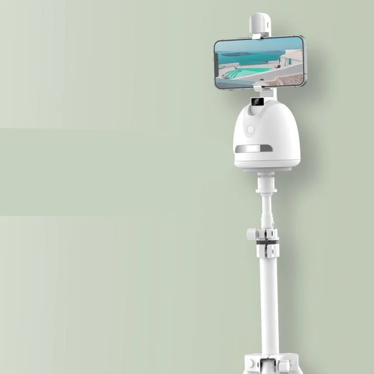 Smartphone face tracking camera mount with fill light on a desk for indoor vlogging
