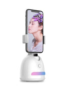 Smartphone face tracking camera mount with fill light on a desk for indoor vlogging