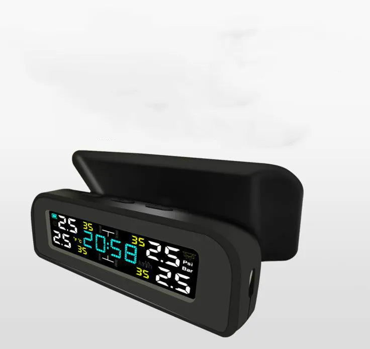 Black wireless solar tyre pressure monitor receiver on car dashboard with internal and external sensor options