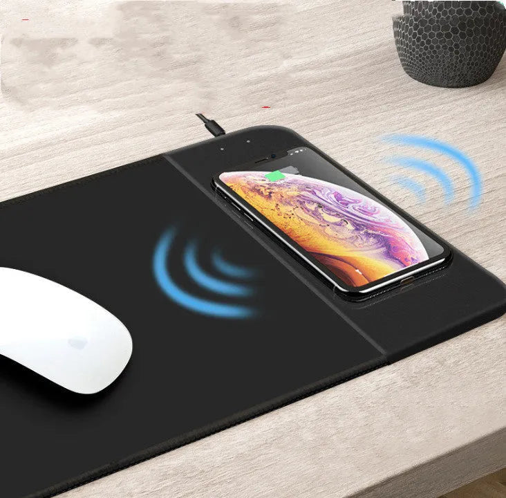 Black wireless charging mouse pad with RGB lighting showing 29.8x21.5cm dimensions and USB cable