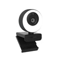 Black Full HD USB webcam with built-in microphone and magnetic privacy cover on a desk.