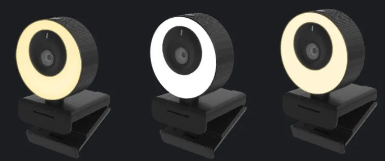 Black Full HD USB webcam with built-in microphone and magnetic privacy cover on a desk.