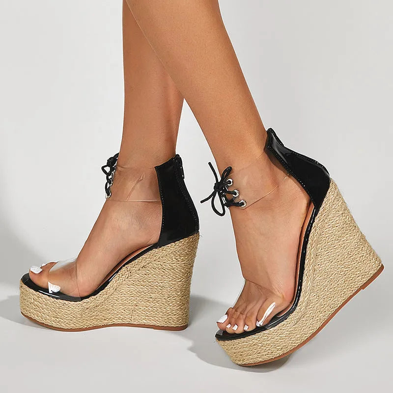 Black women's wedge sandals with hemp rope detail on the upper and a super high platform wedge heel.