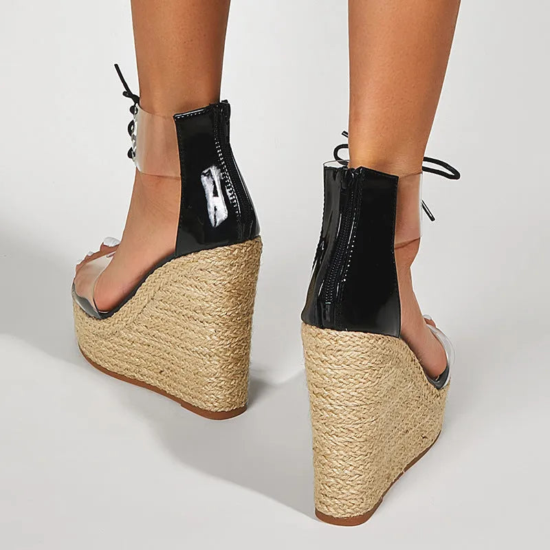 Black women's wedge sandals with hemp rope detail on the upper and a super high platform wedge heel.