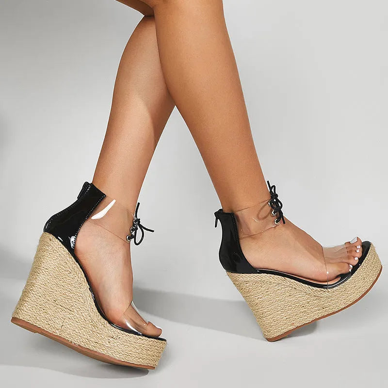 Black women's wedge sandals with hemp rope detail on the upper and a super high platform wedge heel.