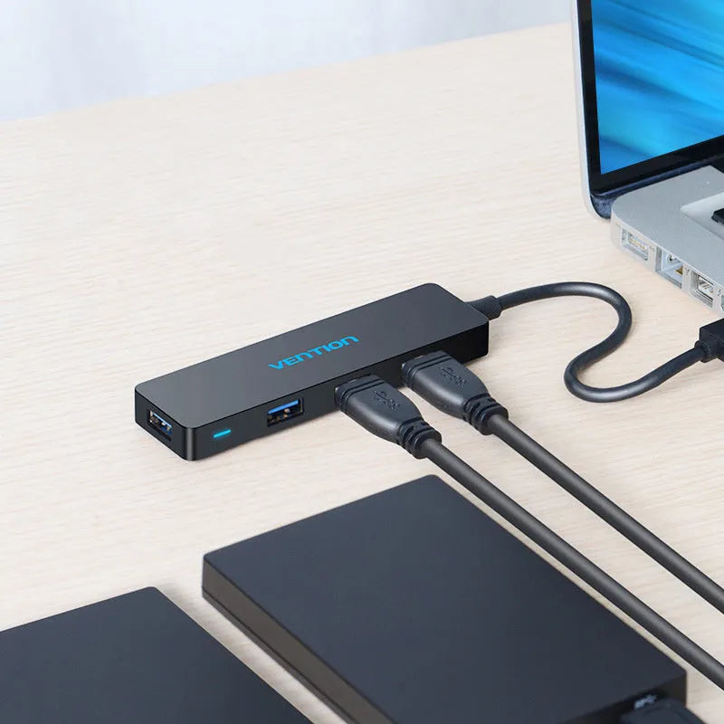 Black four-port USB 3.0 hub expansion device with 0.15 metre cable