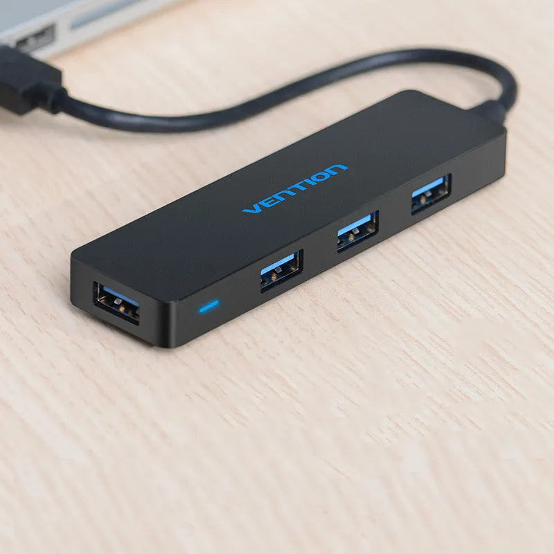 Black four-port USB 3.0 hub expansion device with 0.15 metre cable