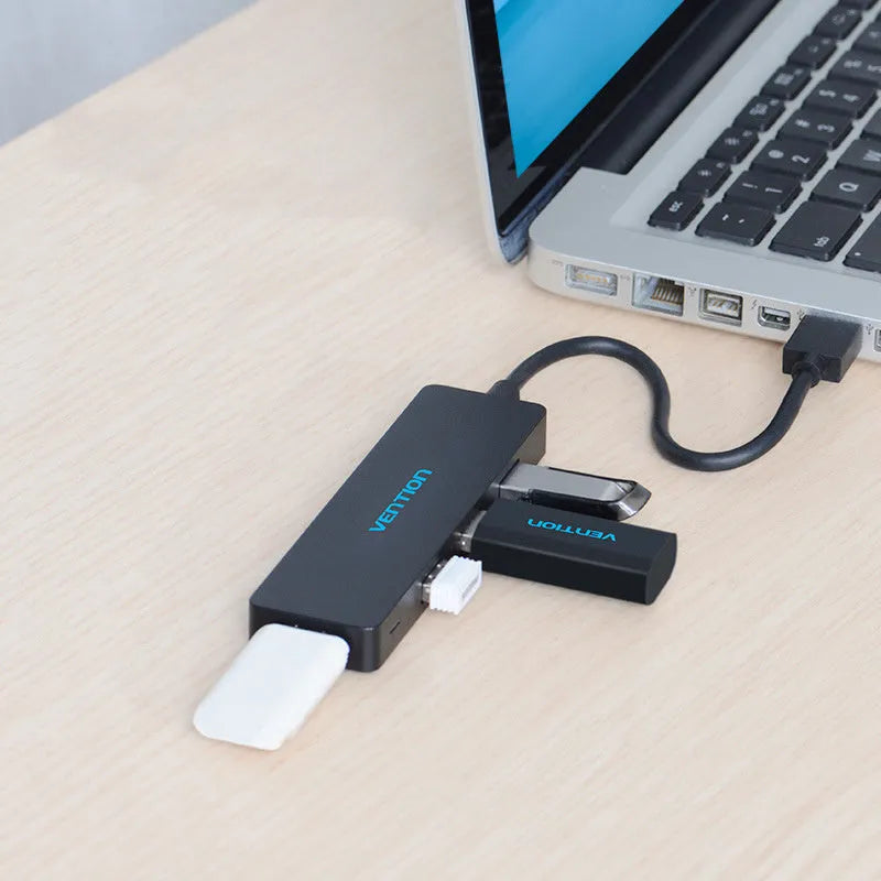 Black four-port USB 3.0 hub expansion device with 0.15 metre cable