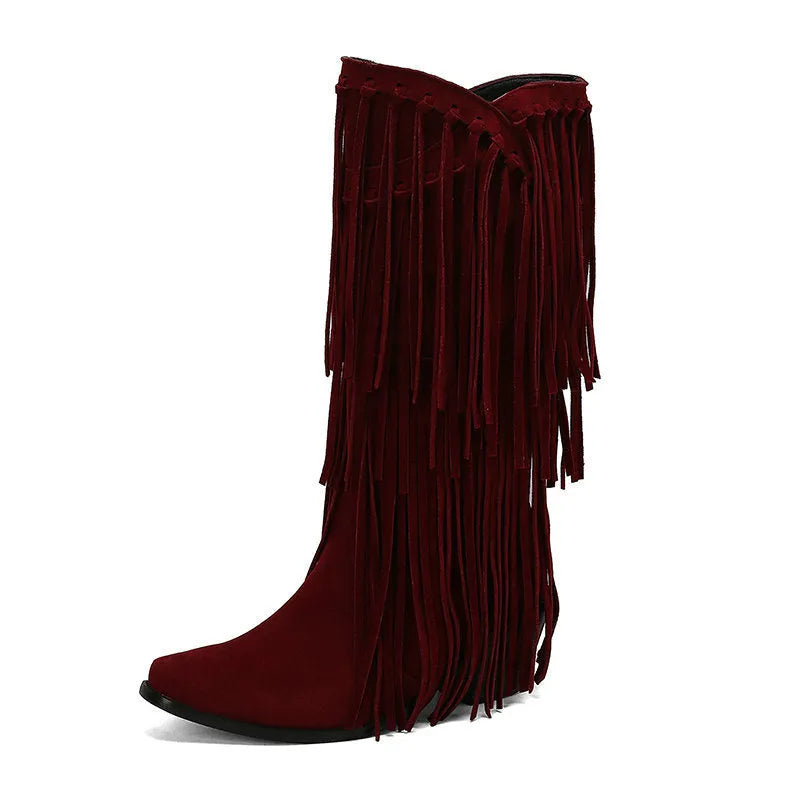 Women's black suede knee-high boots with a chunky heel and tassel decoration.
