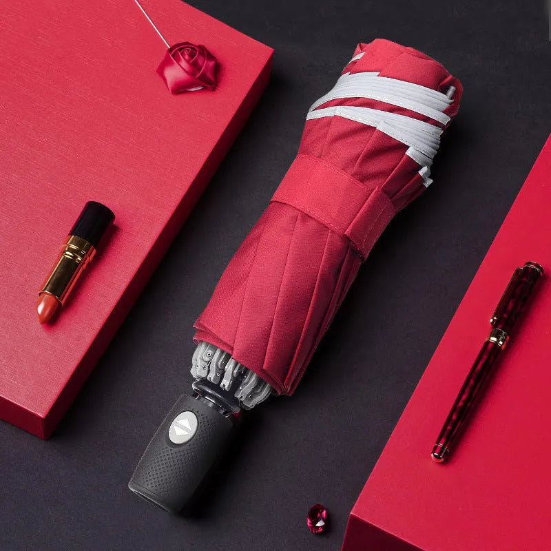 Black full automatic reverse umbrella open, showing 10-bone structure and plastic non-slip handle.