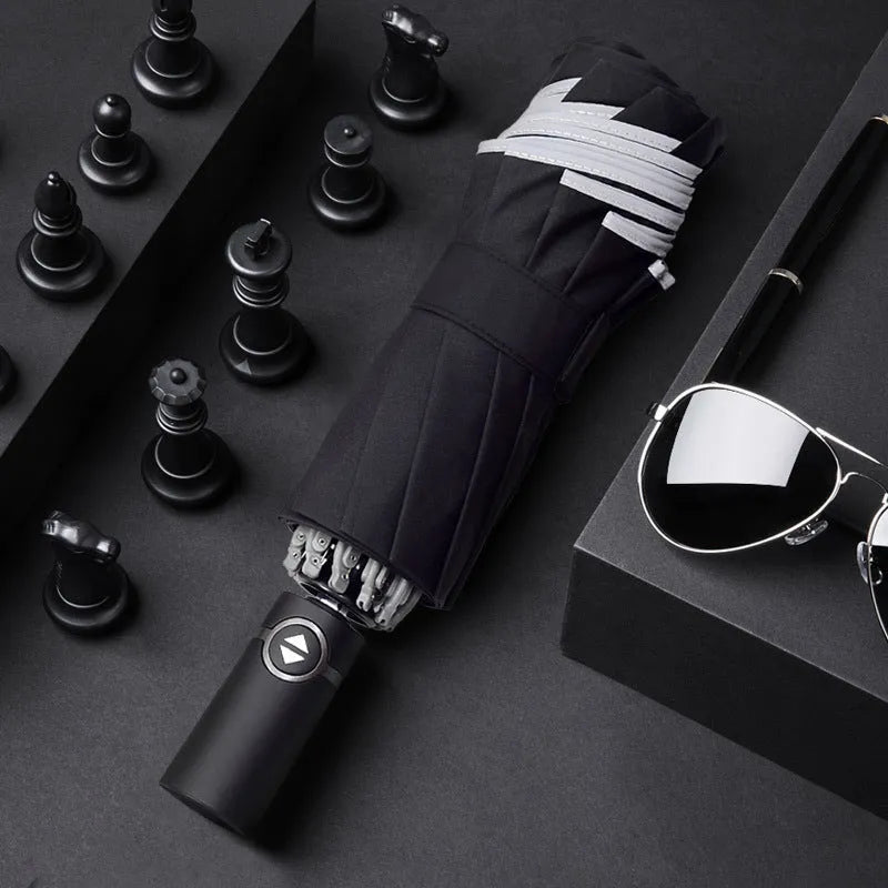 Black full automatic reverse umbrella open, showing 10-bone structure and plastic non-slip handle.