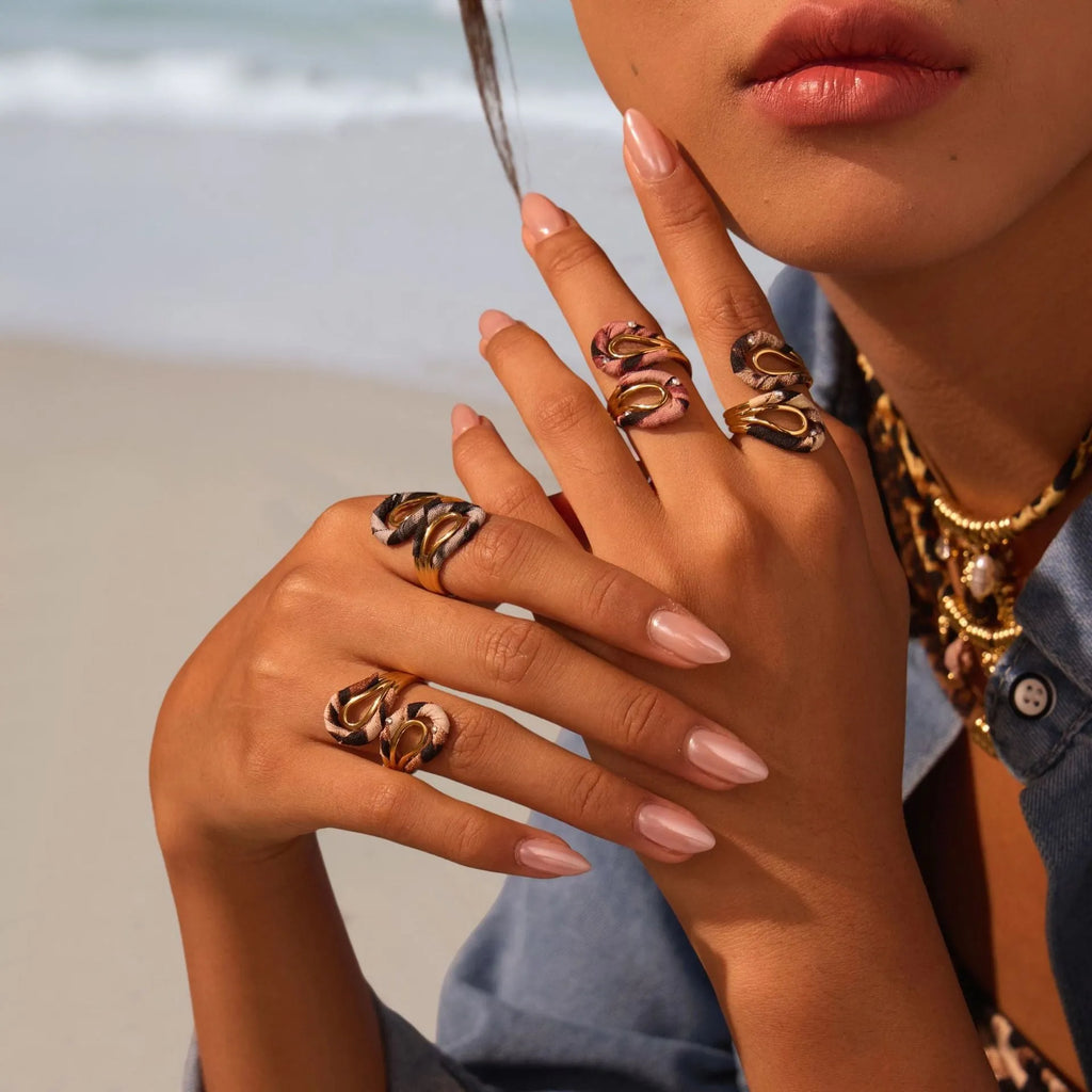 Leopard print geometric open mouth adjustable ring in stainless steel, showing heart shape on finger.