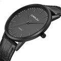 Quartz watch with alloy case and mesh strap showing black face with gold hands