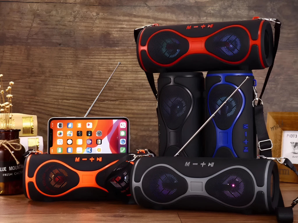 Lantern multifunctional Bluetooth speaker with strap and phone stand in black, blue, orange, red, or silver grey.