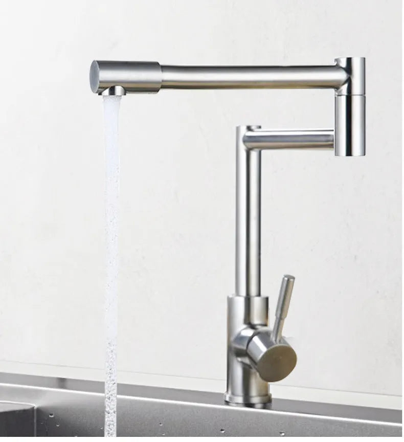 Silver stainless steel kitchen mixer tap with dual handles and rotating spout