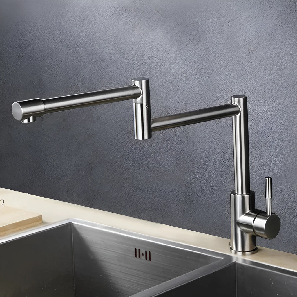 Silver stainless steel kitchen mixer tap with dual handles and rotating spout