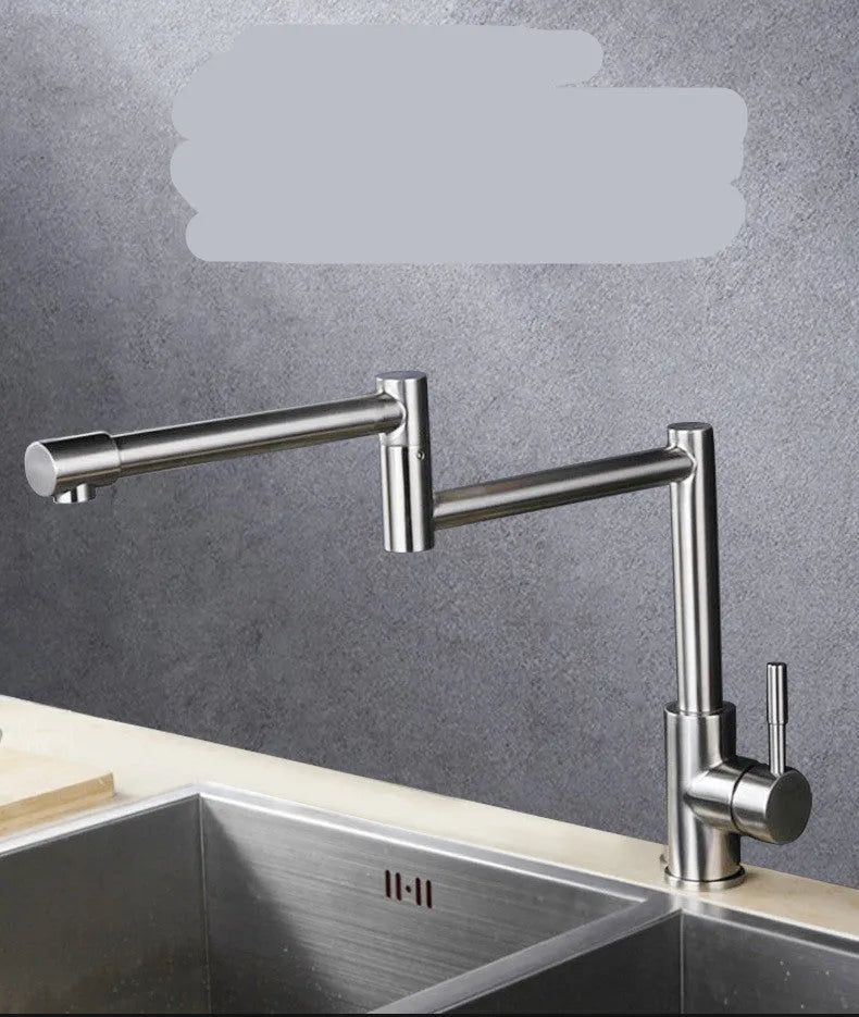 Silver stainless steel kitchen mixer tap with dual handles and rotating spout