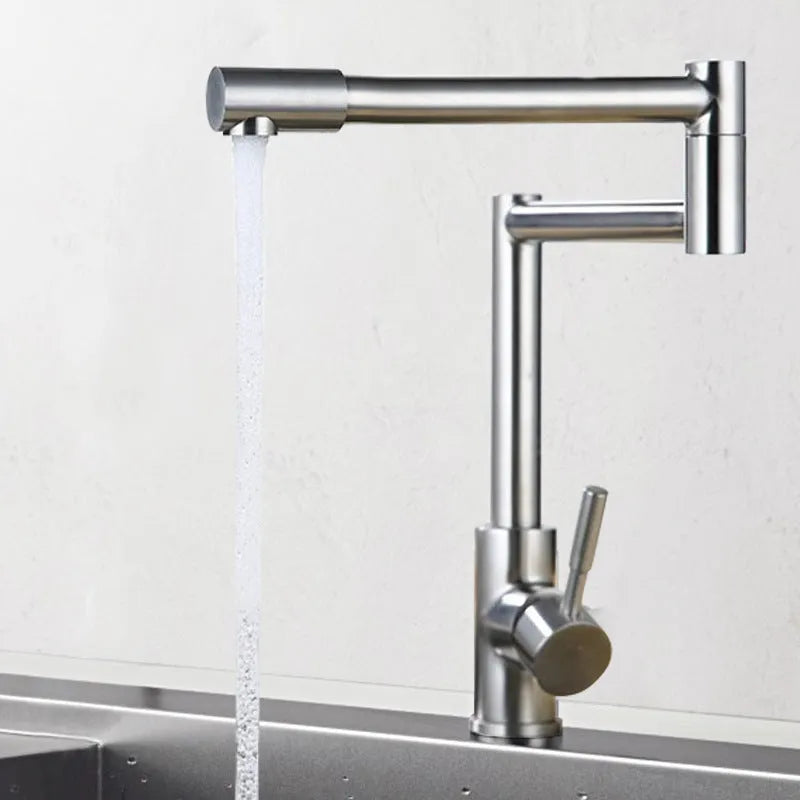 Silver stainless steel kitchen mixer tap with dual handles and rotating spout