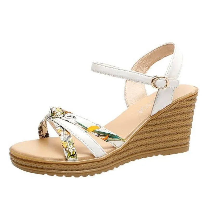 Women's pink wedge sandals with a fish mouth opening and buckle strap on a non-slip PU sole.