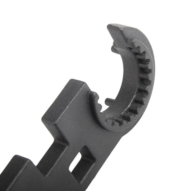 Black all-steel dual purpose combination wrench for AR15 and M4 firearm assembly and maintenance.
