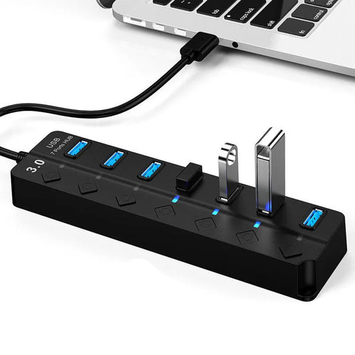 Black seven-port USB 3.0 hub with external power supply unit and cables