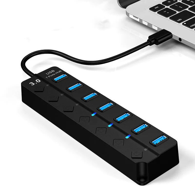 Black seven-port USB 3.0 hub with external power supply unit and cables