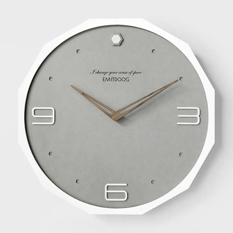 Round 12 inch Nordic minimalist wall clock with wooden frame on a light-coloured wall.