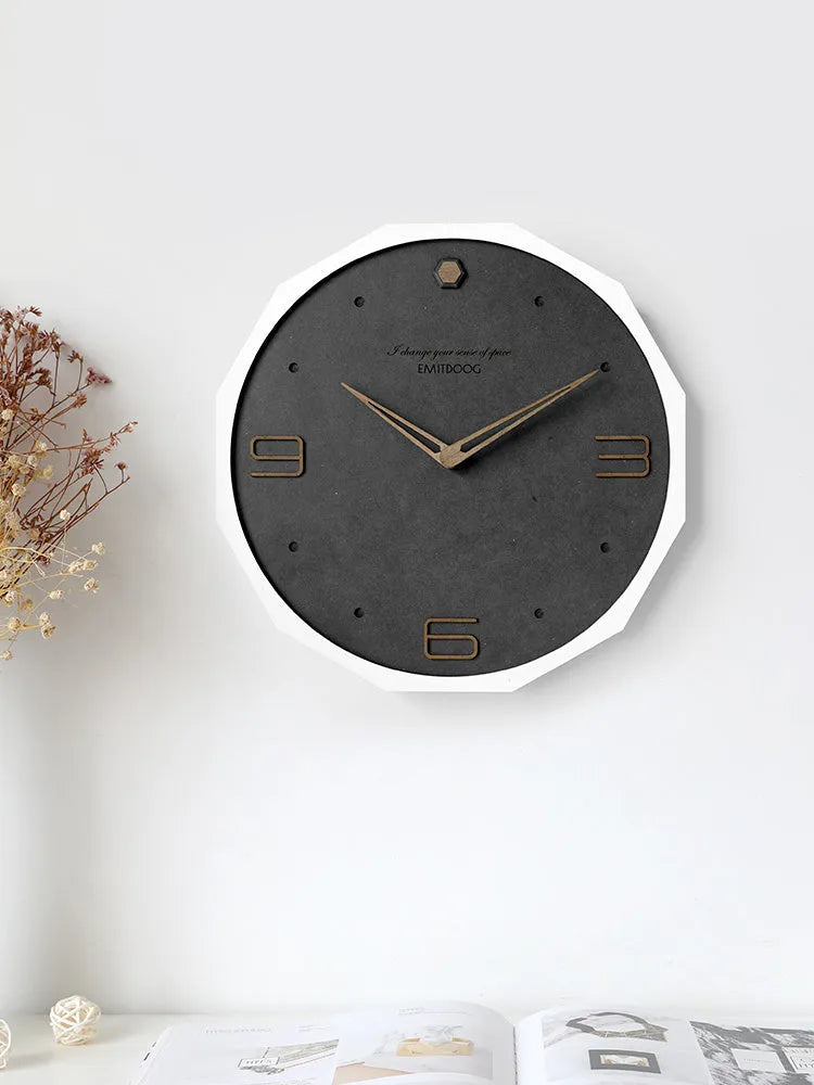 Round 12 inch Nordic minimalist wall clock with wooden frame on a light-coloured wall.