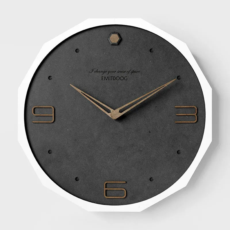 Round 12 inch Nordic minimalist wall clock with wooden frame on a light-coloured wall.