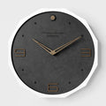 Round 12 inch Nordic minimalist wall clock with wooden frame on a light-coloured wall.