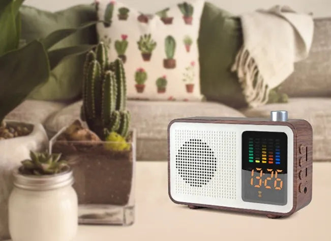 Brown woodgrain retro-style Bluetooth speaker with FM radio dials and a front fabric grille.