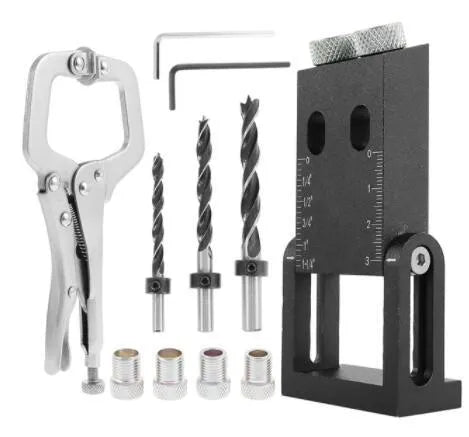 Black aluminium woodworking perforation locator tool with drill bits on a wooden surface