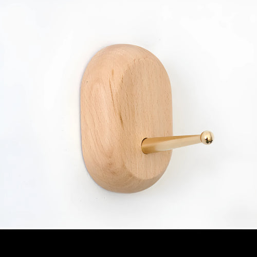Beech wood adhesive wall hook with brass finish in capsule shape, shown next to round, oval, diamond and square variants.