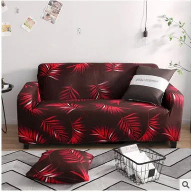 Geometric abstract printed stretch sofa slipcover covering a three-seater sofa with matching cushion covers.