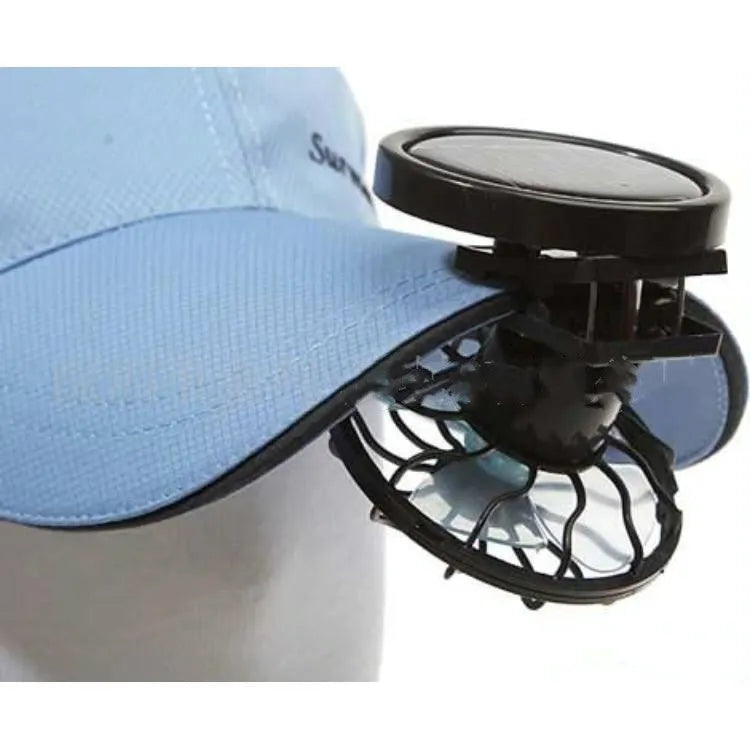 Black portable solar fan with clip and fold-out solar panel for outdoor cooling.