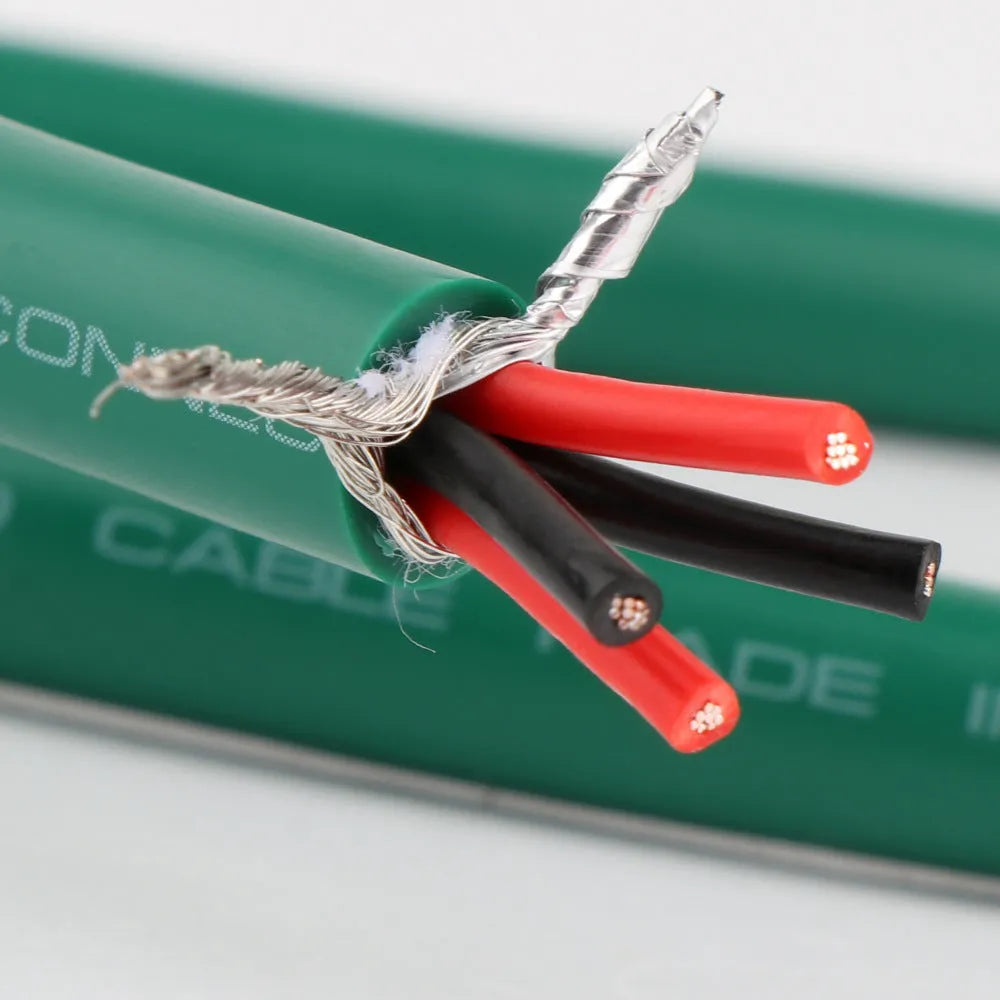Silver audiophile RCA audio cable with lotus plugs, showing 4-core shielded construction.