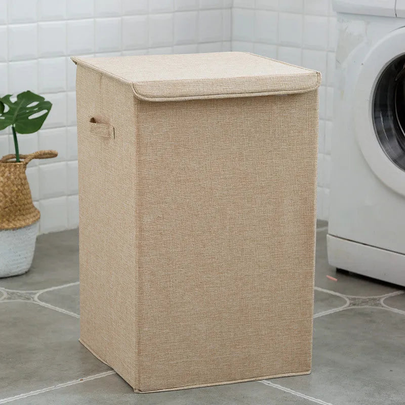 Washable fabric laundry sorting box in beige, showing cotton linen material and covered design for bathroom storage.