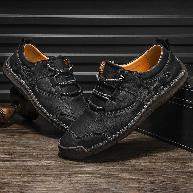 Men's black microfiber casual leather shoes with round toe on white background