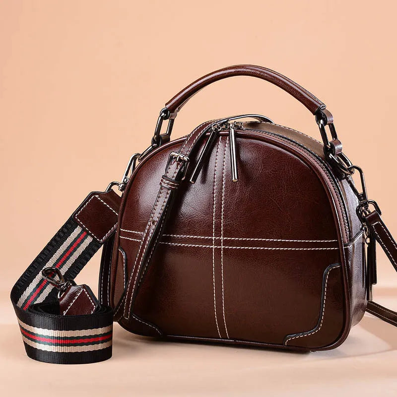 Round leather handbag with zipper and double soft handles in multiple colour options